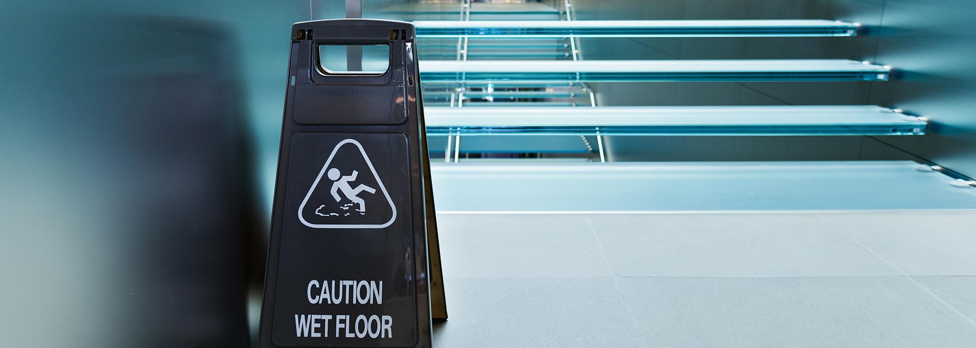 Risk of slip and fall accident injury warning sign.