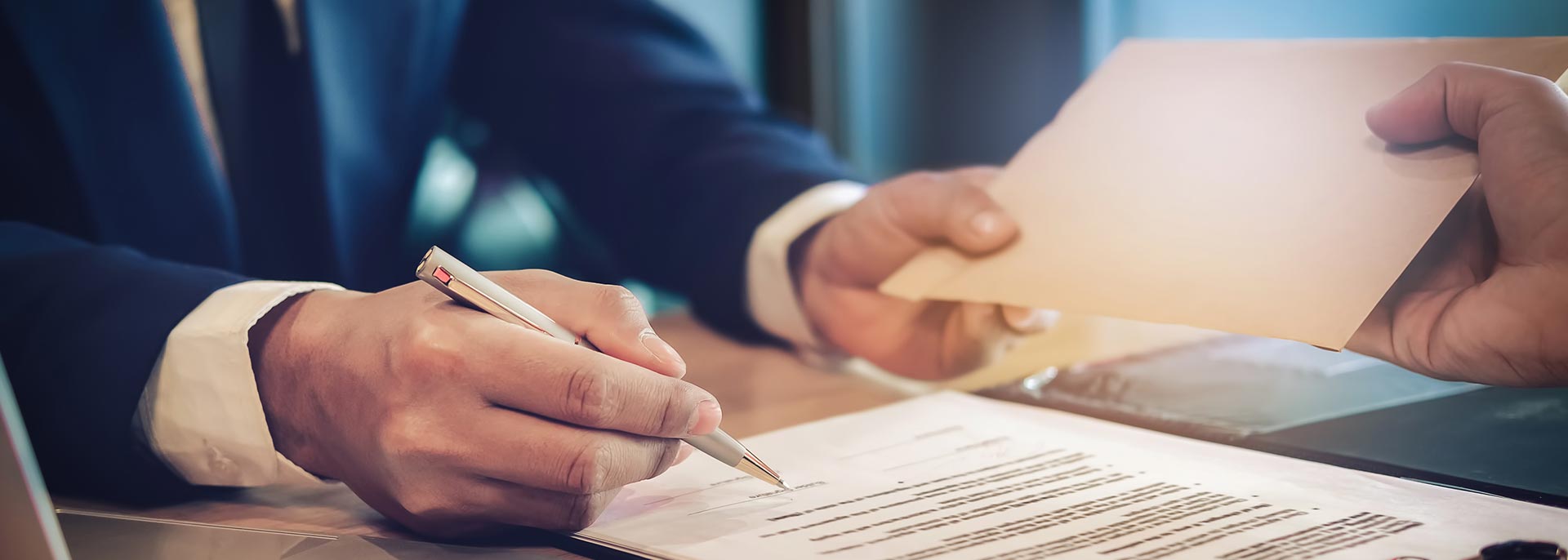 A lawyer filling out a slip and fall claim for a client who is claiming compensation.