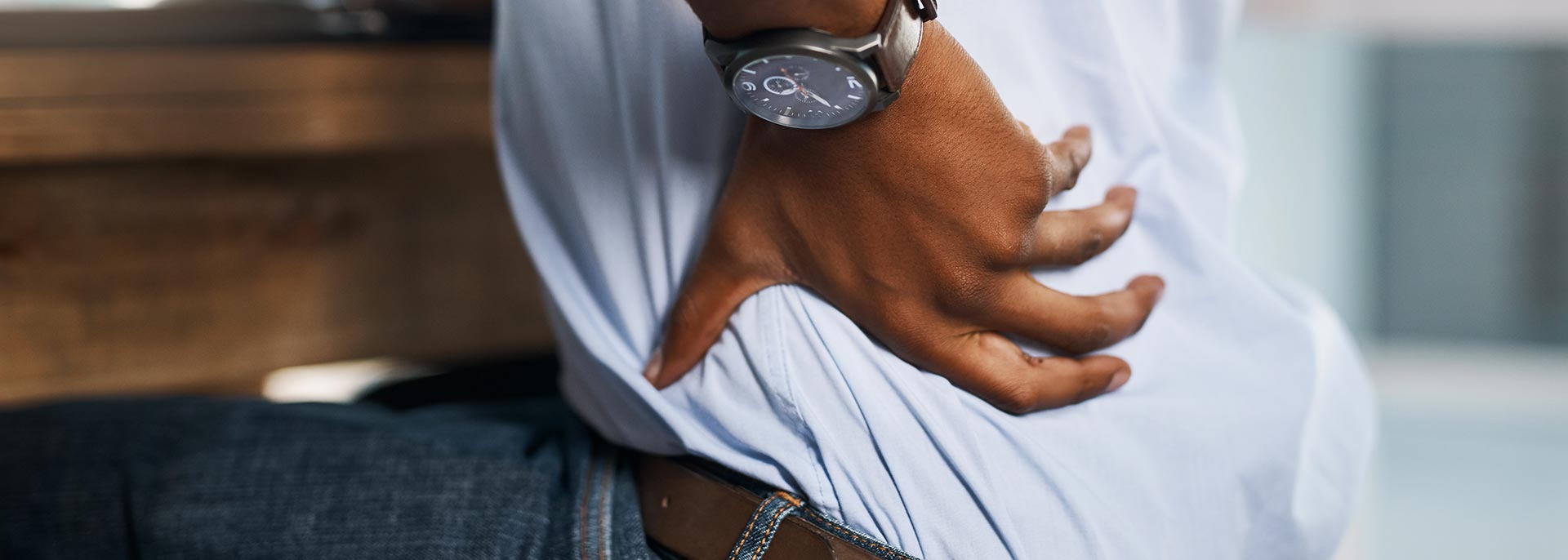 Man with back injury from poor erganomic setup